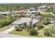 Charming home with lush landscaping, a canal view, and an attached two-car garage at 2441 Vance Ter, Port Charlotte, FL 33981