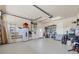 Spacious garage with ample storage, workbench area, and overhead lighting, perfect for hobbies and projects at 2441 Vance Ter, Port Charlotte, FL 33981