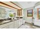 Spacious main bathroom with dual sinks, granite countertops, and a bathtub at 2441 Vance Ter, Port Charlotte, FL 33981