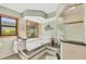 Well-lit main bathroom with a large soaking tub, tiled shower, and decorative accents at 2441 Vance Ter, Port Charlotte, FL 33981