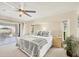 Relaxing main bedroom with a view of the lanai, a ceiling fan, and sliding glass doors for natural light at 2441 Vance Ter, Port Charlotte, FL 33981