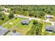 Aerial view of the property with a spacious, fenced backyard, showcasing room for recreation and outdoor enjoyment at 2678 Alva St, North Port, FL 34291