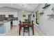 Cozy dining area adjacent to the kitchen, perfect for casual meals and entertaining guests at 2678 Alva St, North Port, FL 34291