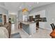 Modern kitchen with a large island, granite countertops, stainless steel appliances, and ample storage at 2678 Alva St, North Port, FL 34291