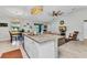 Bright, modern kitchen with granite countertops, stainless steel appliances, and an open layout to the living area at 2678 Alva St, North Port, FL 34291