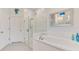 Elegant bathroom with a soaking tub, separate shower, and white tile accents for a spa-like experience at 2692 Wax Myrtle Ct, Port Charlotte, FL 33953