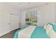 Cozy bedroom with a large window and closet at 2692 Wax Myrtle Ct, Port Charlotte, FL 33953