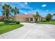 Charming single-Gathering home featuring a beautiful tile roof, attached garage, and meticulously landscaped yard at 2692 Wax Myrtle Ct, Port Charlotte, FL 33953