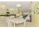 Bright kitchen and breakfast nook with white cabinets, granite countertops, and lovely natural light at 2692 Wax Myrtle Ct, Port Charlotte, FL 33953
