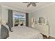 Bright main bedroom with access to an outdoor patio with water views at 2692 Wax Myrtle Ct, Port Charlotte, FL 33953