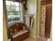Charming bathroom with a bench, window, and walk-in shower at 2864 Traverse Ave, North Port, FL 34286
