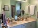 Bathroom features a double sink vanity, neutral color scheme, ample counter space and medicine cabinets at 2864 Traverse Ave, North Port, FL 34286