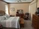 Comfortable bedroom featuring a large bed, ceiling fan, and decorative trim at 2864 Traverse Ave, North Port, FL 34286