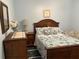 Inviting bedroom featuring a queen-sized bed, soft colors, and wood accents at 2864 Traverse Ave, North Port, FL 34286