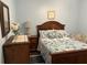 Relaxing bedroom with a queen-sized bed, soft colors, and wood accents at 2864 Traverse Ave, North Port, FL 34286