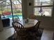 Cozy kitchen nook with a view of the pool and backyard at 2864 Traverse Ave, North Port, FL 34286