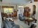 Bright and open living room featuring an archway leading to other rooms, neutral colors, and comfortable seating at 2864 Traverse Ave, North Port, FL 34286