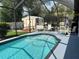 Screened in pool, with patio seating and view of the shed at 2864 Traverse Ave, North Port, FL 34286