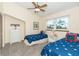 Cozy bedroom featuring two twin beds, carpet flooring and bright natural light at 301 S Gulf Blvd # 3, Placida, FL 33946