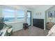 This bedroom features carpet flooring, a window with an ocean view and closet space at 301 S Gulf Blvd # 3, Placida, FL 33946