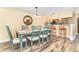 Dining room with seating for six, hardwood flooring, and views of the kitchen at 301 S Gulf Blvd # 3, Placida, FL 33946