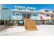 Stunning beach house exterior with stairs leading to a welcoming entrance and ocean views at 301 S Gulf Blvd # 3, Placida, FL 33946