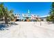 Charming beach homes on stilts with sandy surroundings under a bright blue sky at 301 S Gulf Blvd # 3, Placida, FL 33946