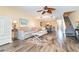 Cozy living room featuring wood floors, comfortable seating, and stairs to the upper level at 301 S Gulf Blvd # 3, Placida, FL 33946