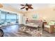 Living room featuring water views, beachy decor, comfortable seating, and access to the outdoors at 301 S Gulf Blvd # 3, Placida, FL 33946