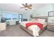 The main bedroom features amazing ocean views, a ceiling fan and carpet flooring at 301 S Gulf Blvd # 3, Placida, FL 33946