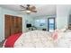 The main bedroom features an ocean view, a ceiling fan, and plenty of closet space at 301 S Gulf Blvd # 3, Placida, FL 33946