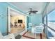 Screened porch with dining set, opens to living room, offering beach views and relaxing setting at 301 S Gulf Blvd # 3, Placida, FL 33946