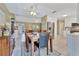 Spacious dining room with views of the living area and modern kitchen appliances at 3025 Curry Ter, Port Charlotte, FL 33981