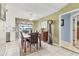 Bright dining area features natural light, neutral walls, ceiling fan, and comfortable seating for Gathering dining at 3025 Curry Ter, Port Charlotte, FL 33981