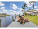 Dock area featuring a seating area, perfect for relaxing by the water and enjoying the scenic waterfront views at 3025 Curry Ter, Port Charlotte, FL 33981