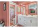 Bright main bathroom with double sink vanity, and framed mirrors at 3025 Curry Ter, Port Charlotte, FL 33981