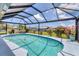Beautiful pool area with landscaping, lounge chairs, and waterfront views, offering a relaxing and inviting outdoor space at 3025 Curry Ter, Port Charlotte, FL 33981
