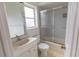 Bathroom with a toilet, tub/shower with sliding glass doors, and a vanity at 407 Park S Blvd, Venice, FL 34285