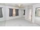Bedroom with light gray walls, carpet, a ceiling fan, and closet with mirrored doors at 407 Park S Blvd, Venice, FL 34285