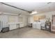 Spacious garage with laundry area, utility sink, and storage cabinets at 407 Park S Blvd, Venice, FL 34285