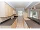 Efficient kitchen design with tile countertops and modern appliances, perfect for cooking and meal preparation at 407 Park S Blvd, Venice, FL 34285