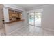 Open kitchen view with breakfast bar, sliding glass doors to lanai and pool at 407 Park S Blvd, Venice, FL 34285