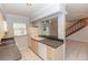 Functional kitchen features tiled floors and countertops, offering efficiency and practicality in a cozy space at 407 Park S Blvd, Venice, FL 34285