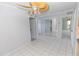 Spacious living room with lots of natural light, gray walls, and tile flooring at 407 Park S Blvd, Venice, FL 34285