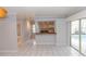 Open-concept living area flows seamlessly into the kitchen and bathroom, and access to the backyard pool at 407 Park S Blvd, Venice, FL 34285