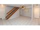 Comfortable living space with tiled floors, a staircase, and an inviting atmosphere perfect for relaxing at 407 Park S Blvd, Venice, FL 34285