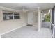 Enclosed porch with tile flooring, ceiling fan, and natural light, ideal for relaxation and entertaining at 407 Park S Blvd, Venice, FL 34285