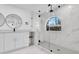 Elegant bathroom with a glass-enclosed shower, marble tile, and modern fixtures at 4210 Day St, Port Charlotte, FL 33948