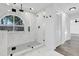 Updated bathroom featuring a glass enclosed shower and marble-look tile at 4210 Day St, Port Charlotte, FL 33948