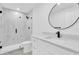 Bright bathroom featuring updated vanity and glass enclosed shower at 4210 Day St, Port Charlotte, FL 33948